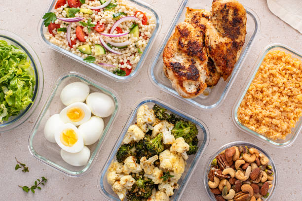 Containers with prepped grains and chopped vegetables
